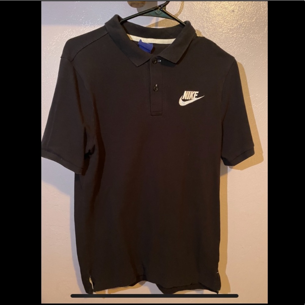 Black and white Nike polo.
